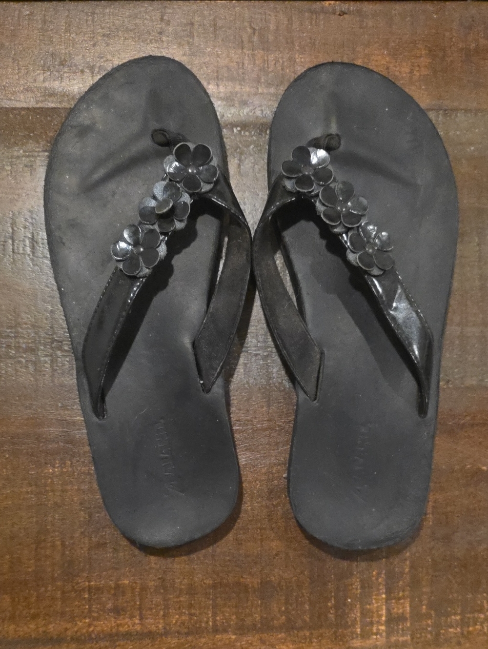Women’s Black Floral-Accent Flip Flops